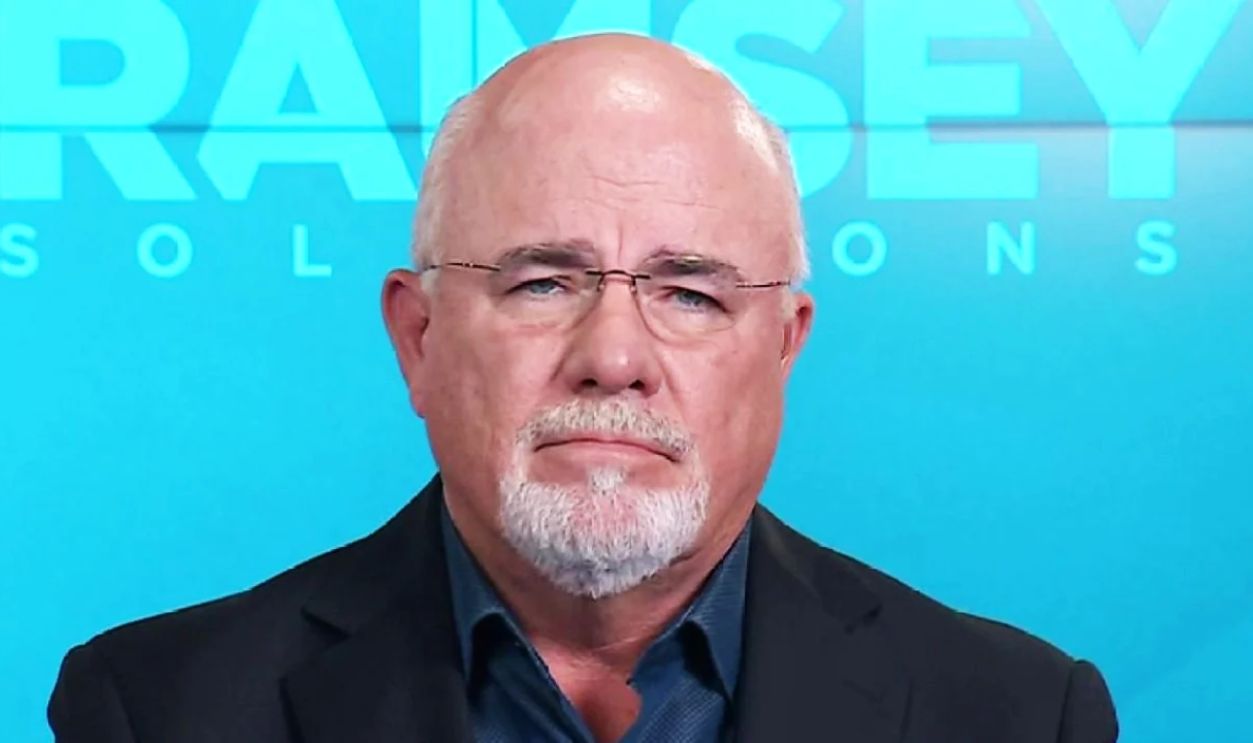 Beautiful and happy senior couple in love sitting on the side of sailboat