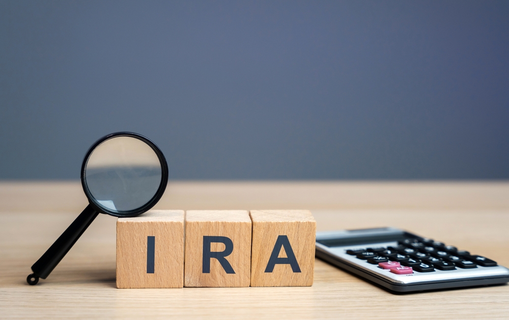 Wooden blocks with the word IRA - individual retirement account