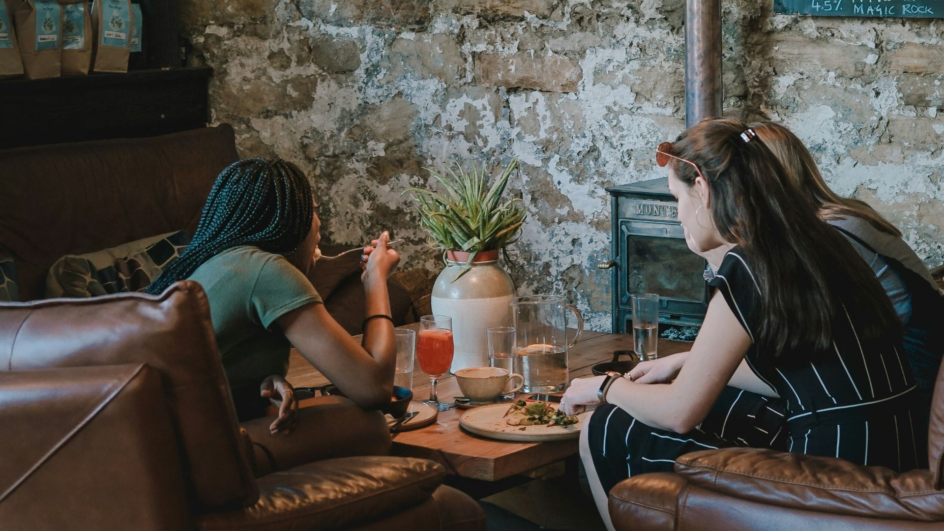 person sitting on chair in front of table