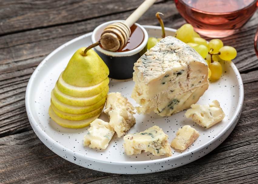 Piece of French Blue cheese grapes, honey and pear for dessert.