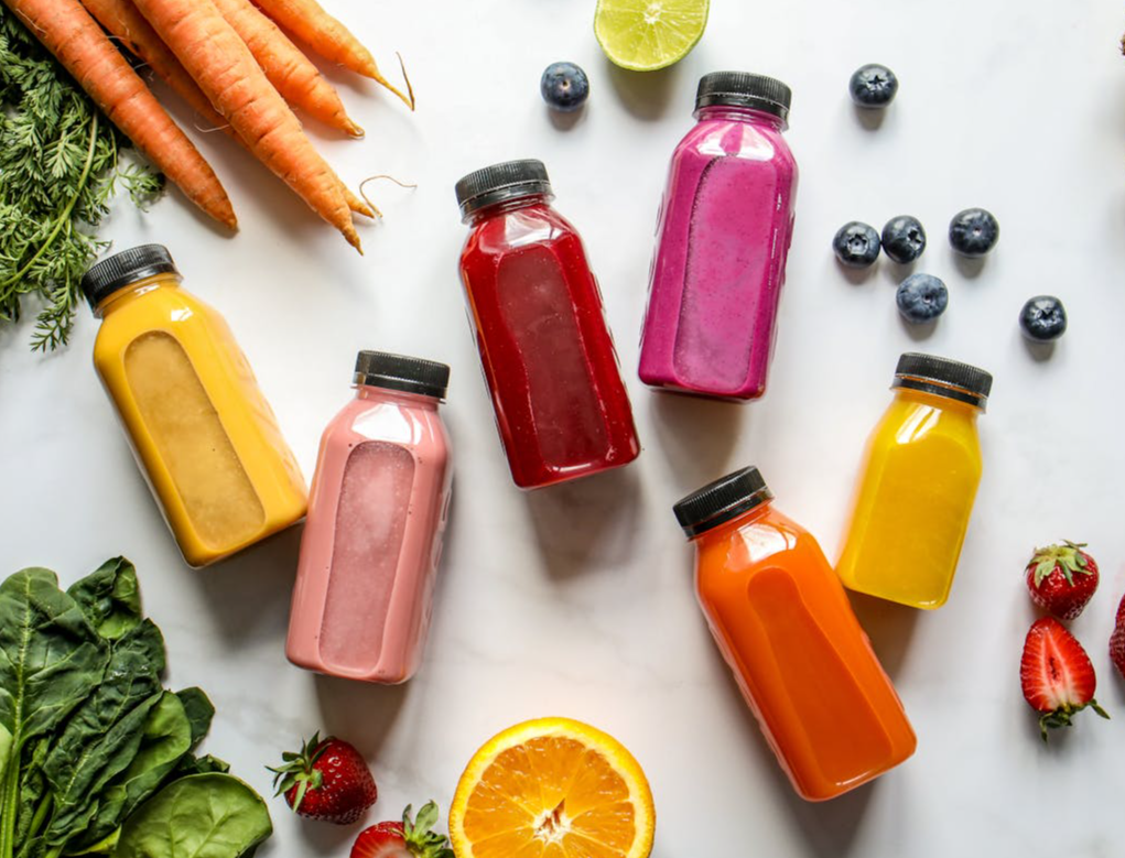 Overhead Photo of Colorful Bottles with Smoothies