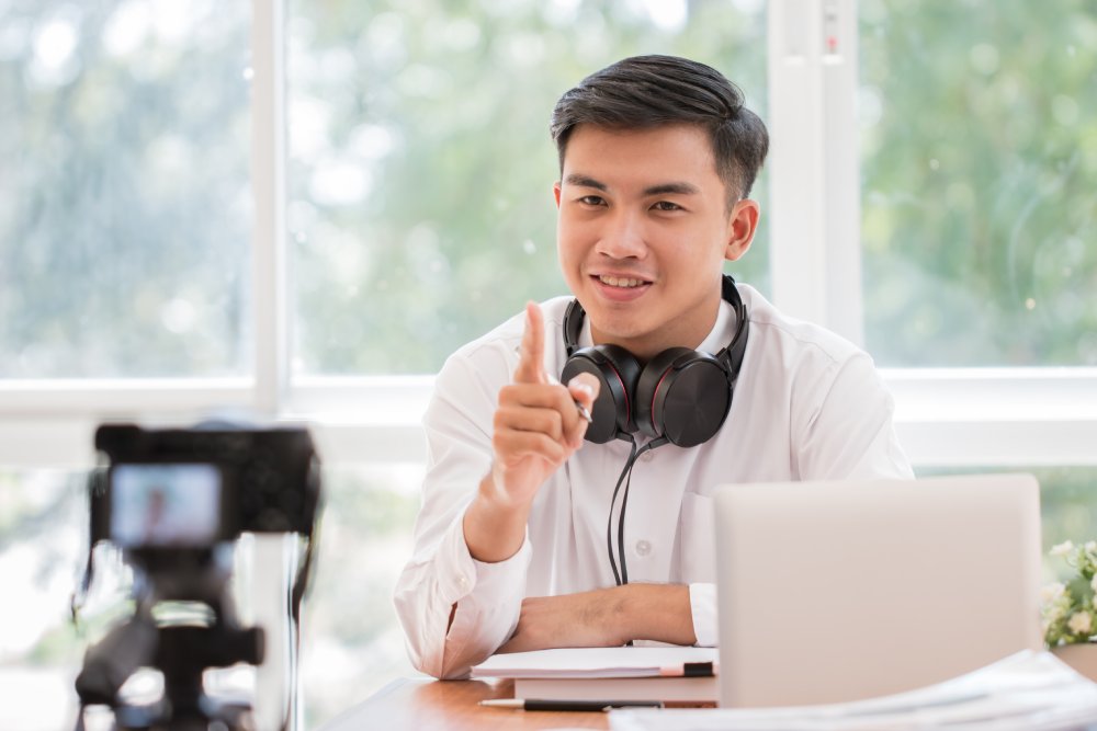 Happy businessman videoblog, blogger vlogger recording online