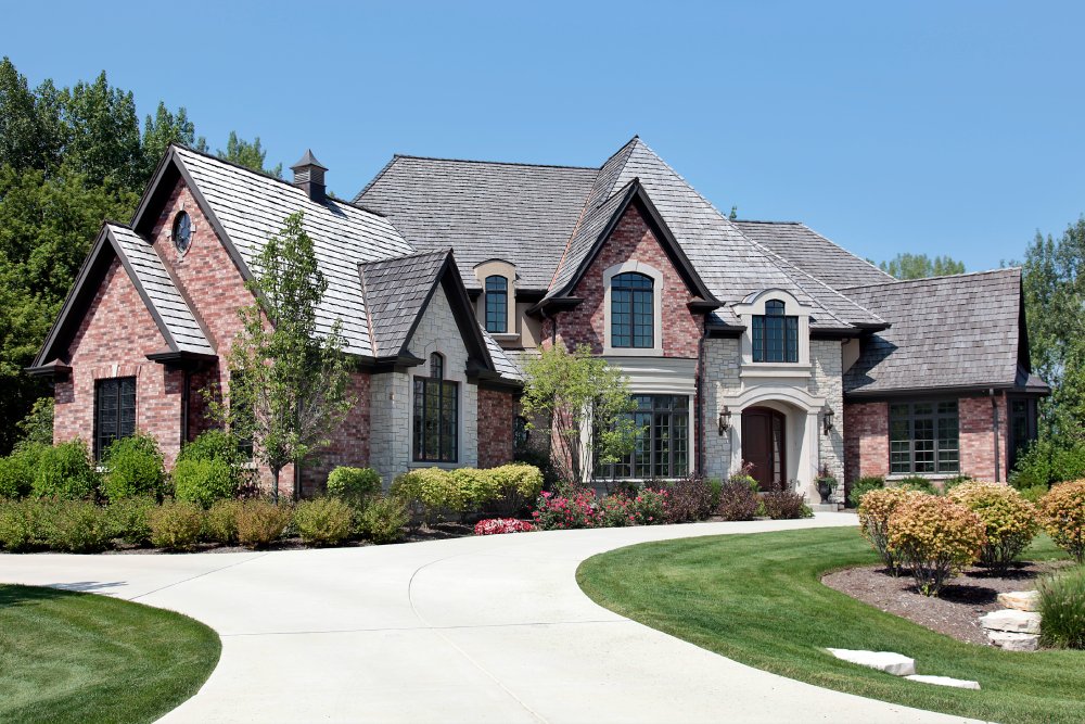Photo of Large brick home with circular driveway