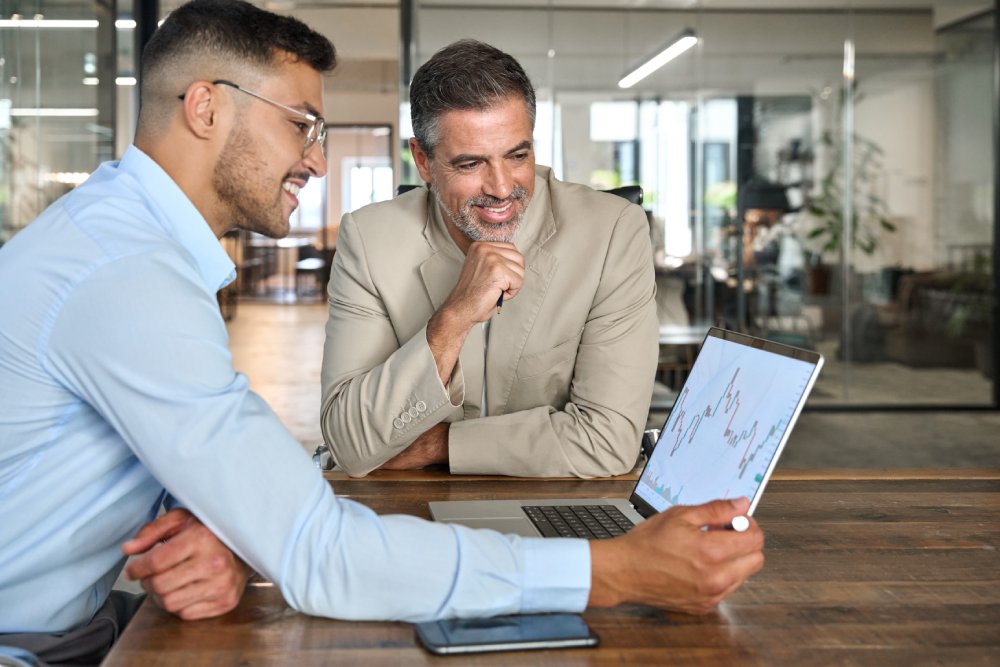 Financial advisor consulting investor explaining financial trade stock data