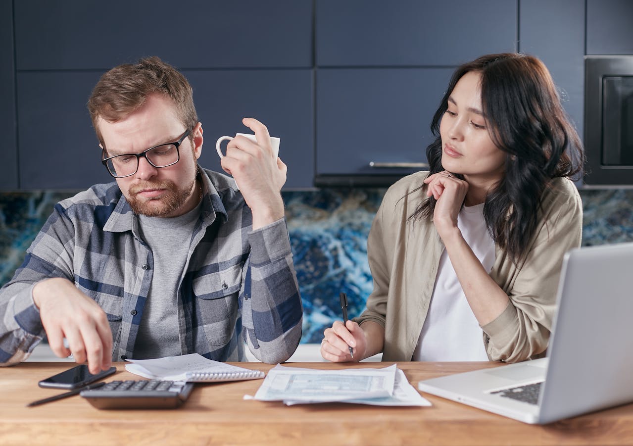 Couple looking at savings.