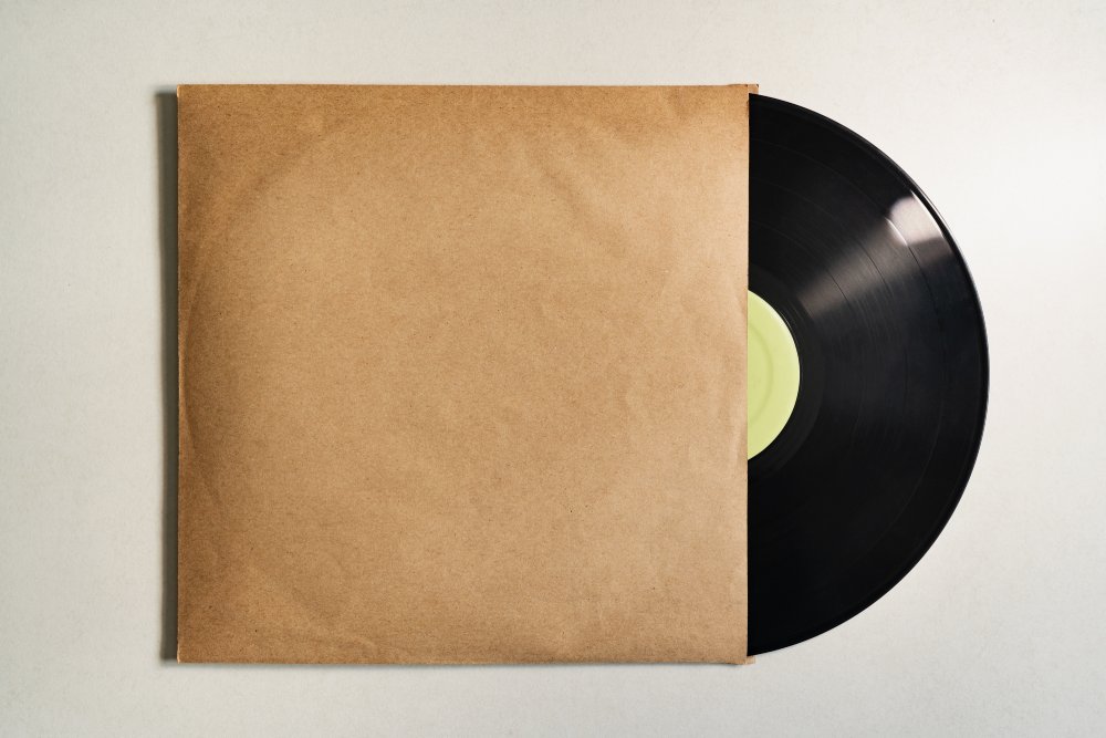 Close Up Photo of Vinyl record in paper sleeve packaging