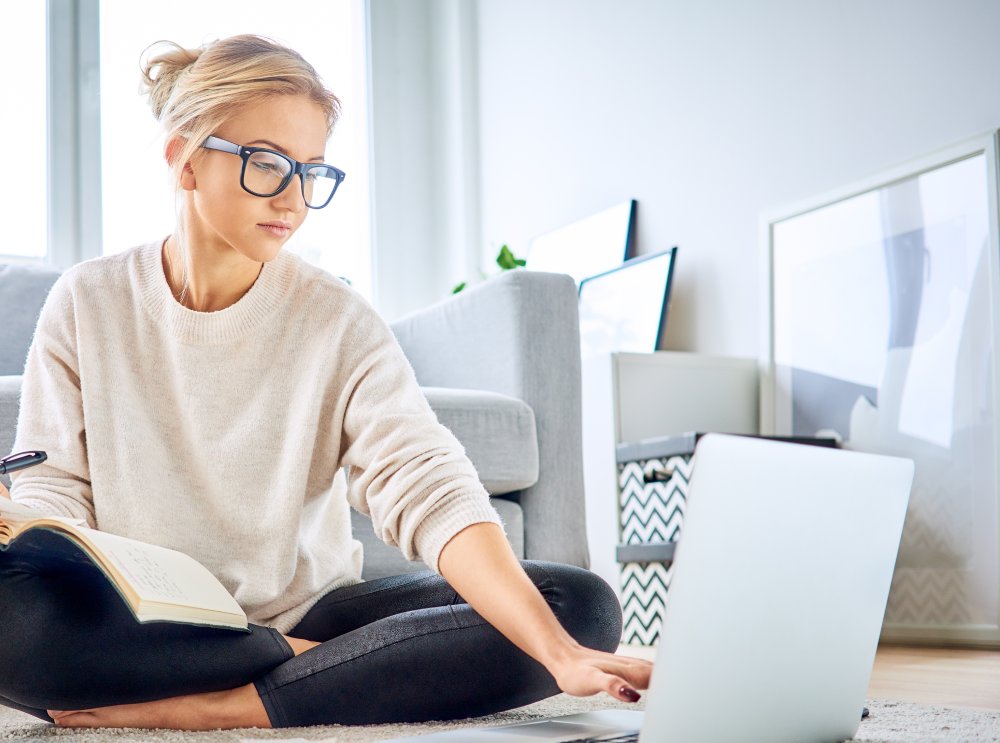 Woman using laptop paying bills online and managing home budget