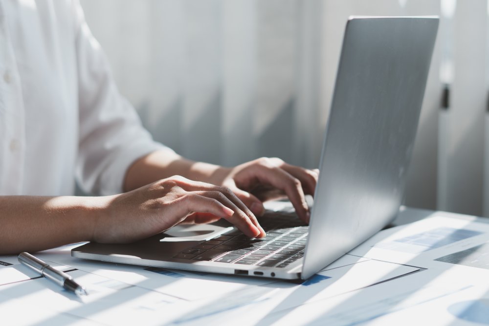 Close up of businessman or accountant working on laptop