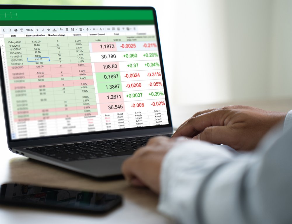 Businessman working with data and graphs in spreadsheet documents