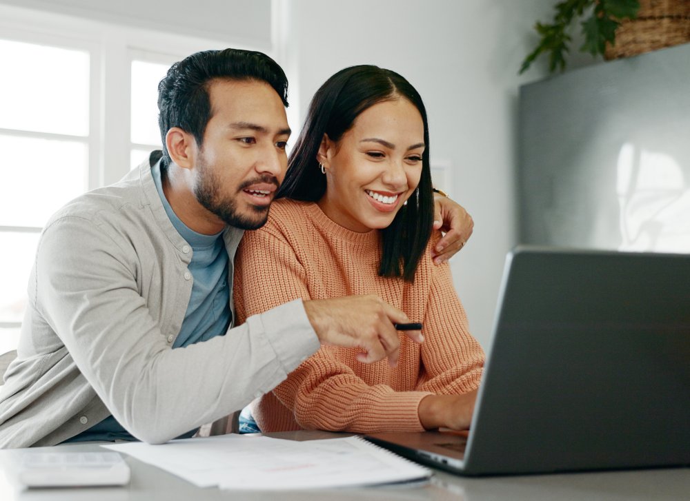 Portrait Photo of Couple track expenses and success for budget goals