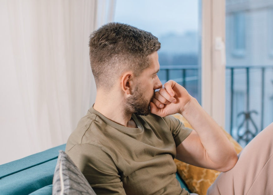 Man thinking and looking at side.