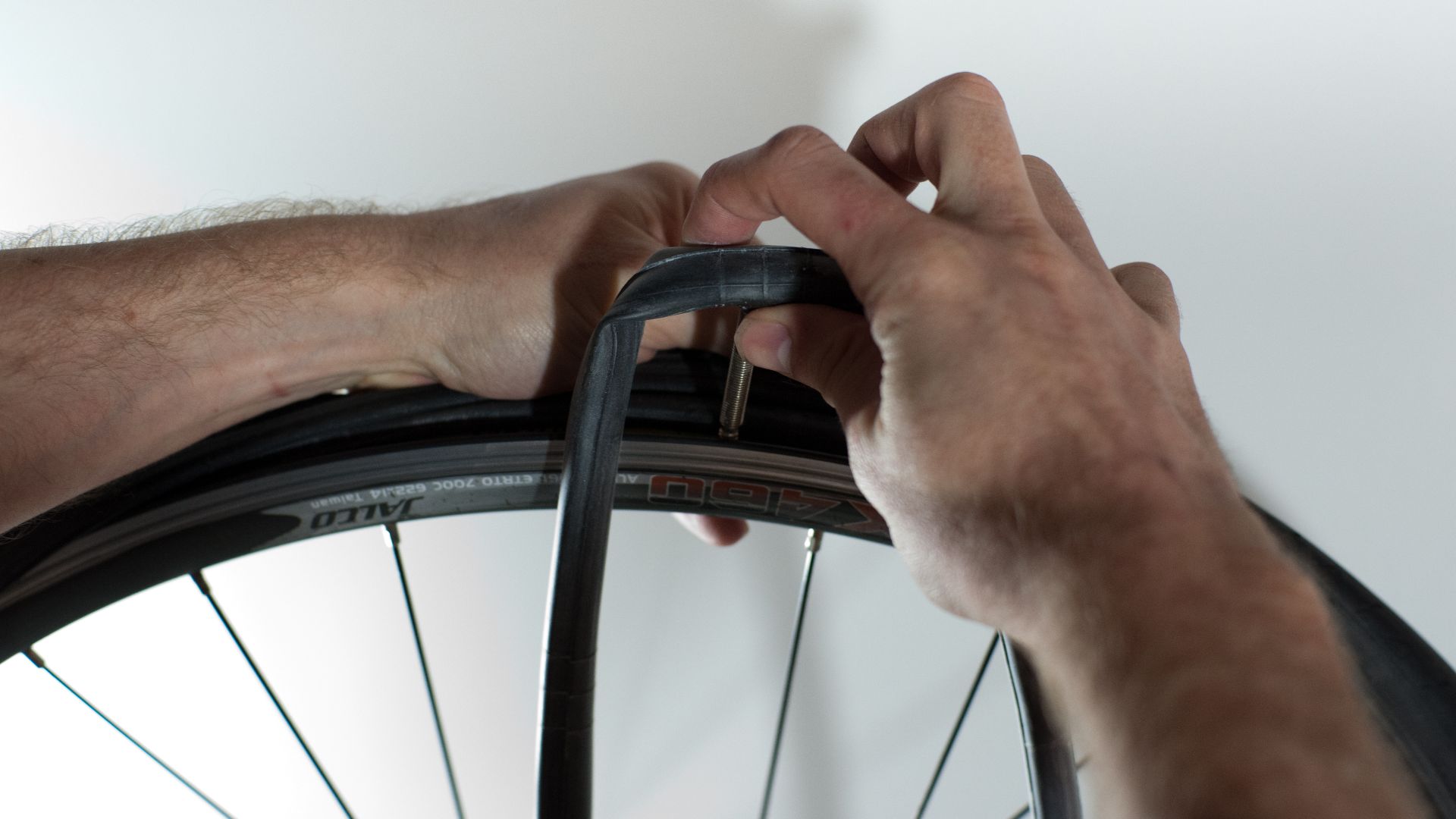 File:Changing an inner tube - Inserting the new tube.jpg