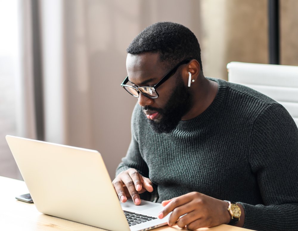 Portrait Photo of man working from home with laptop, remote work