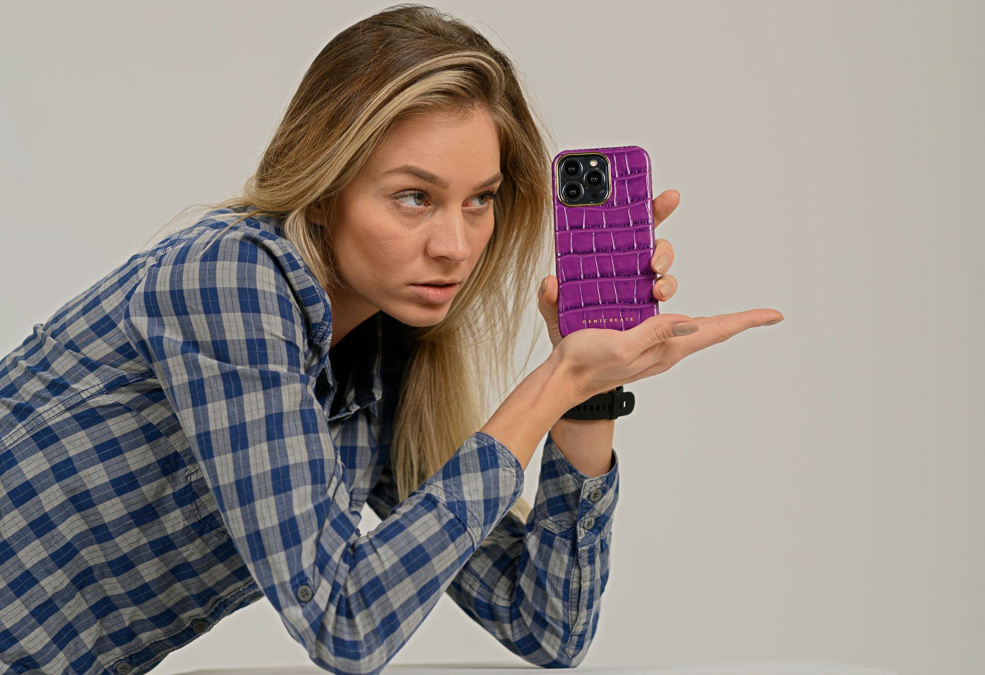 Woman Holding Smartphone with Purple Case