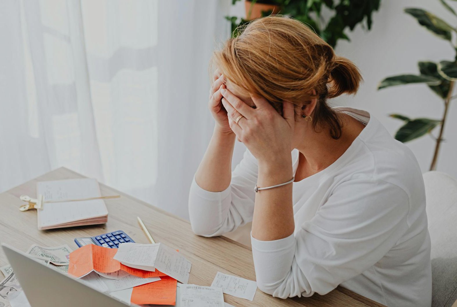 Stressed Woman Managing Finances at Home