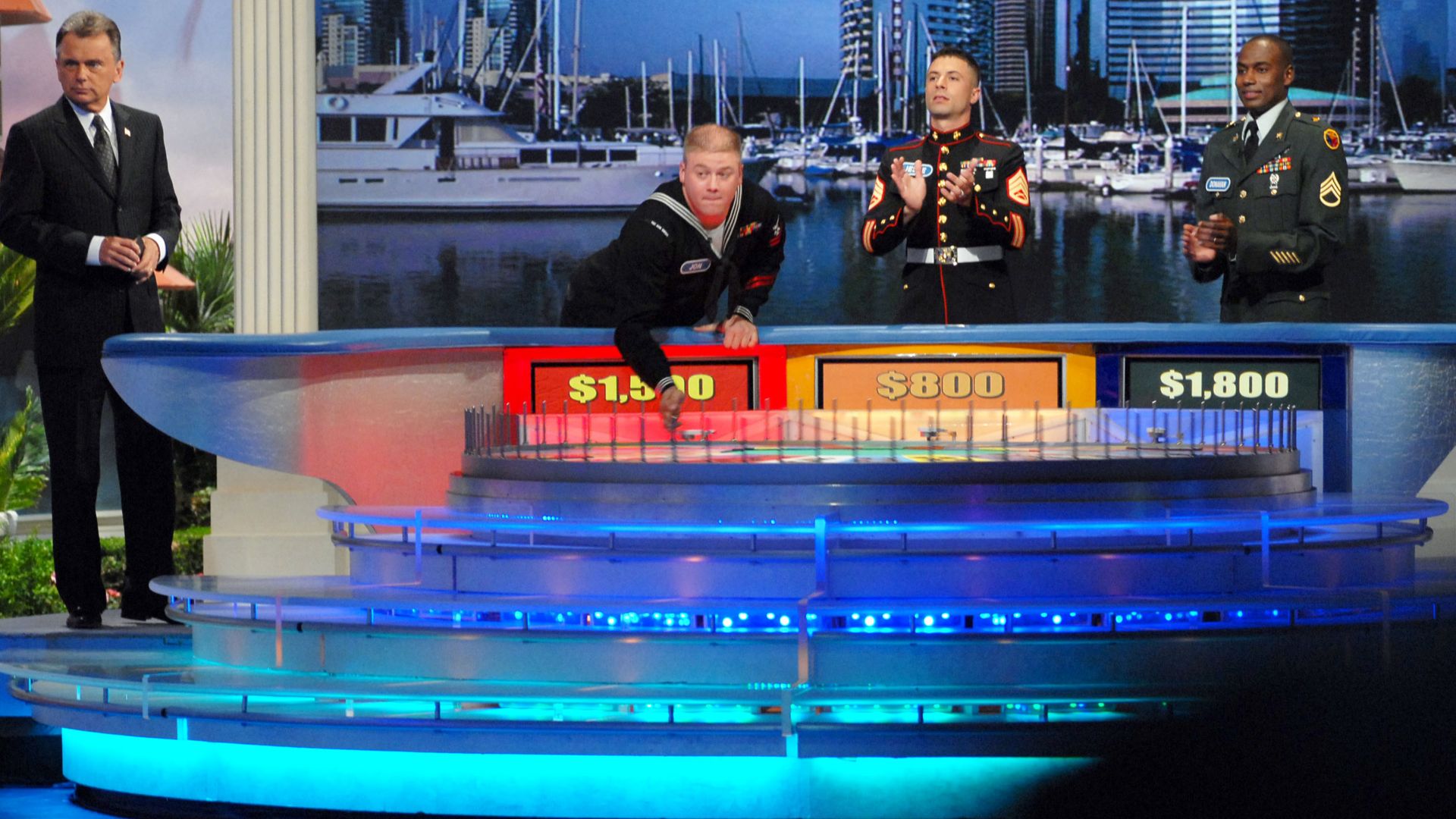 File:US Navy 070325-N-9195K-022 Machinist's Mate 2nd Class John Gates spins the wheel as a contestant on the popular television game show Wheel of Fortune.jpg