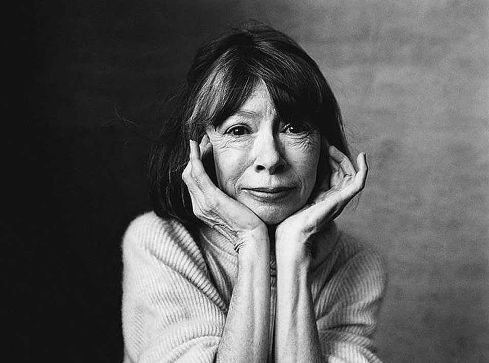 Portrait of Joan Didion looking at camera.
