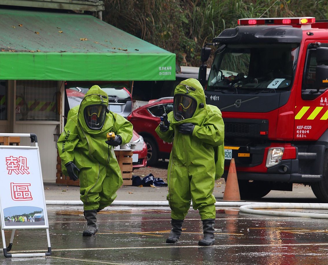 2 HAZMAT personnel in Class A HAZMAT suits