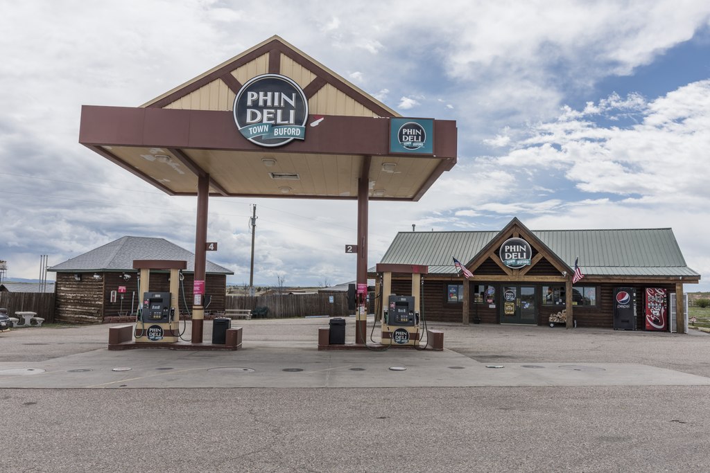 Gas-pump island at Phin-Deli in the tourist-attraction town of Buford in rural Albany County, Wyoming - 2015