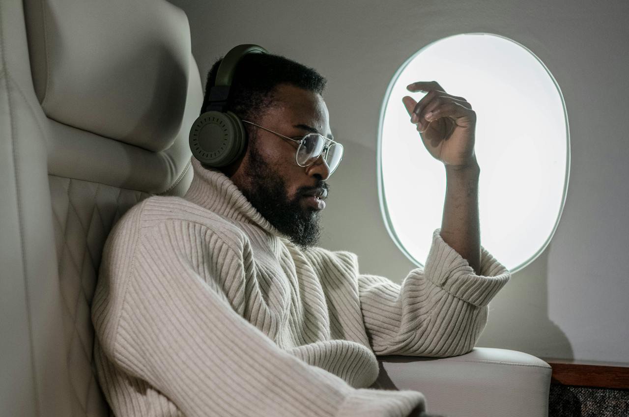 Man in White Sweater Traveling
