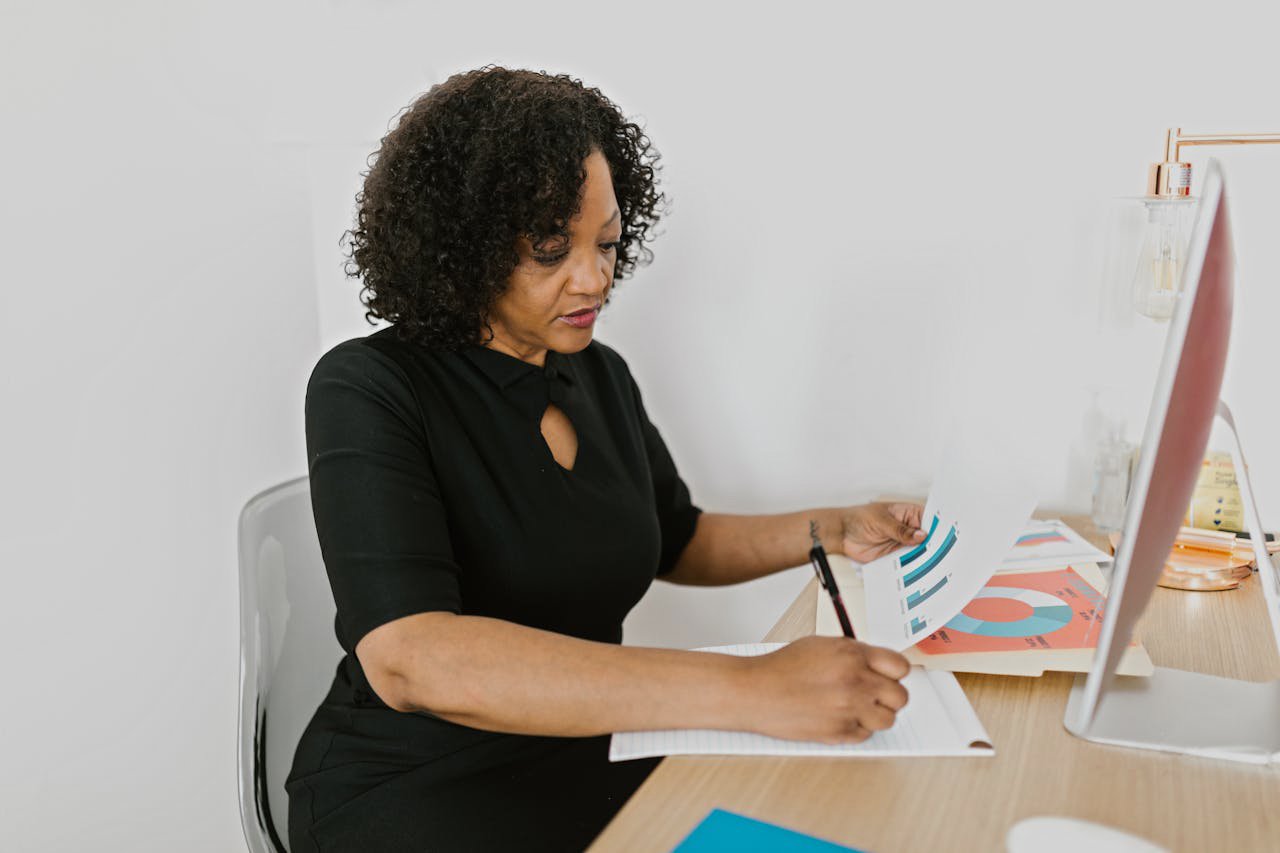 Curly Haired Woman Writing
