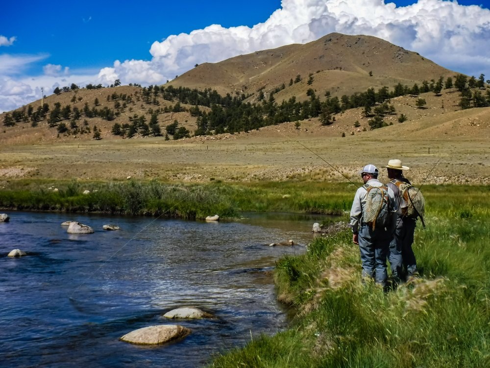 Portrait Photo of a man learning to fly fishing with a professional guide