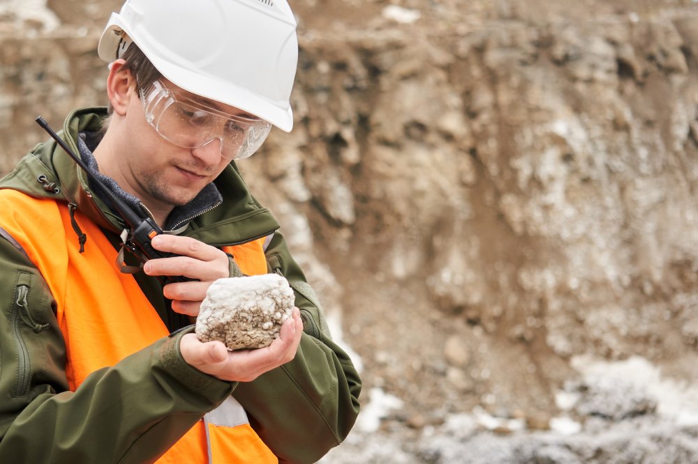 Portrait Photo of male geologist examining a mineral sample