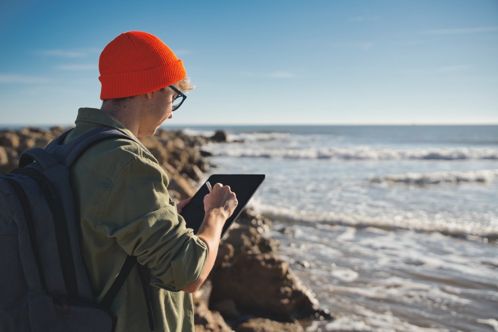 Young marine biologist studying marine fauna with an electronic tablet