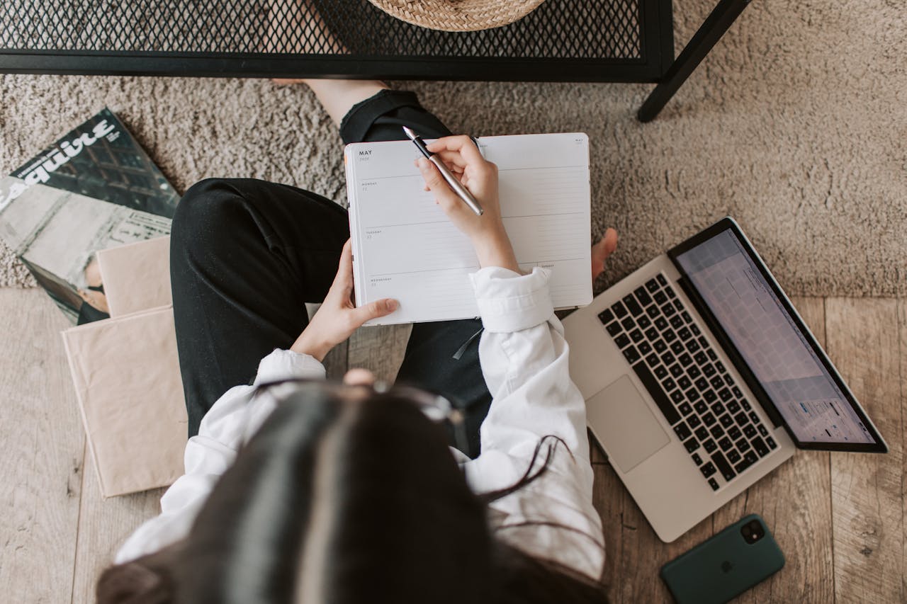 Lady With Notebook And Laptop On The Floor