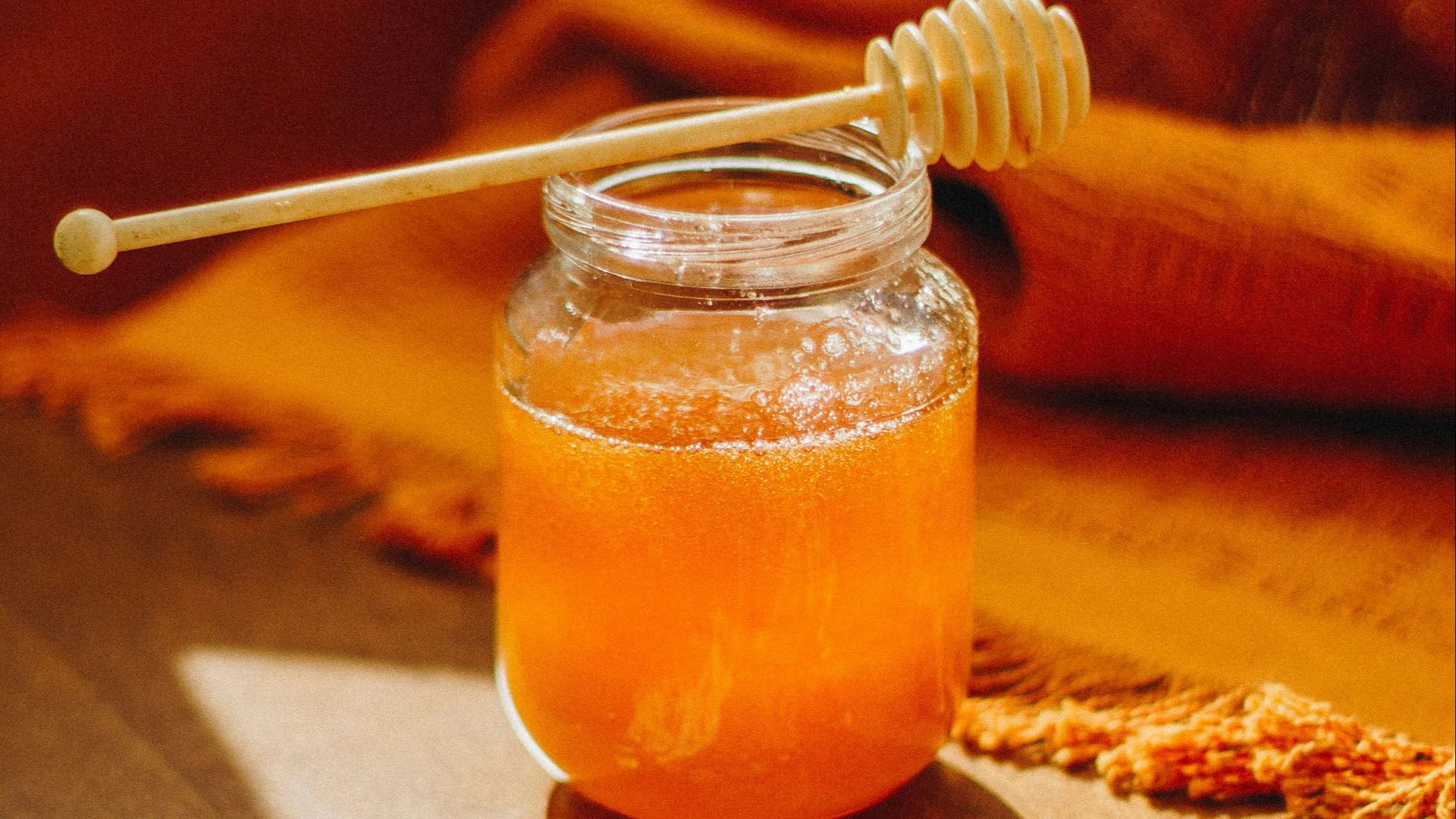 clear glass jar with orange liquid