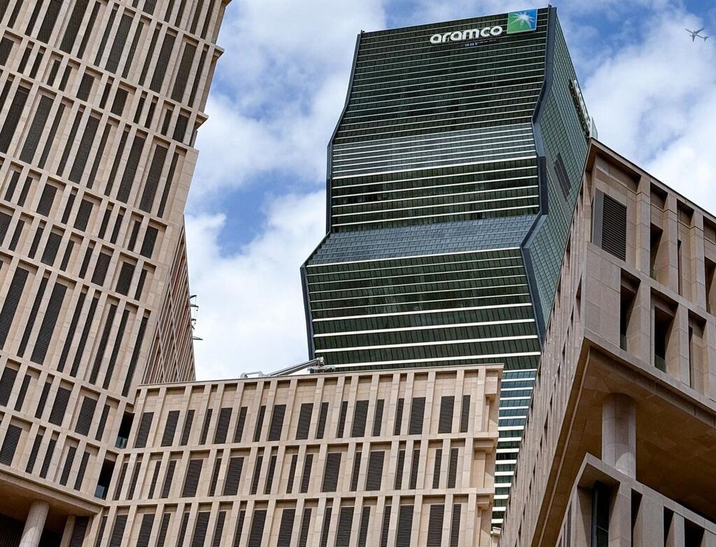 The image shows the corporate headquarters or office building of Saudi Aramco Company