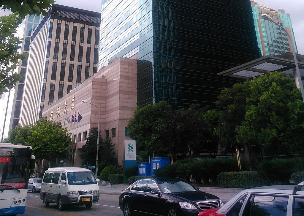 The image shows the corporate headquarters or office building of Baowu Company