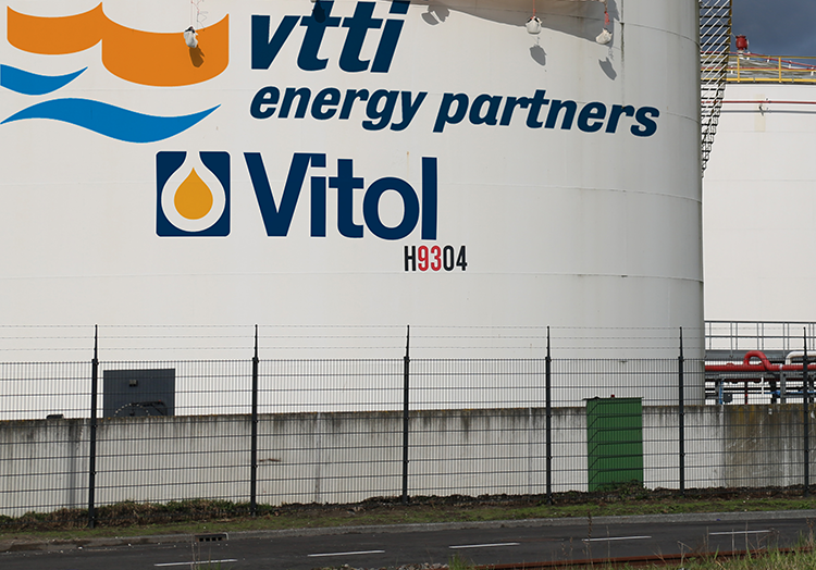 The image shows a close-up of a large, cylindrical storage tank