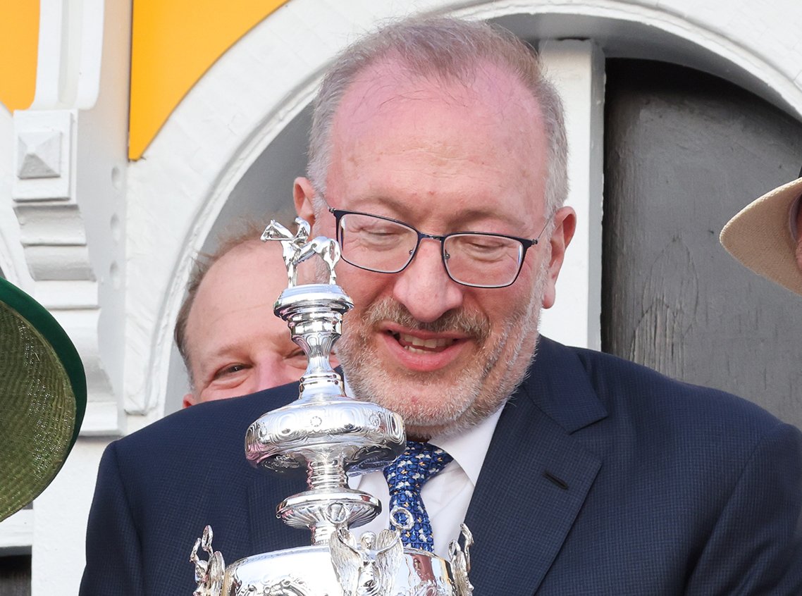 Seth Klarman holding the Woodlawn Vase during 2022 Preakness Stakes