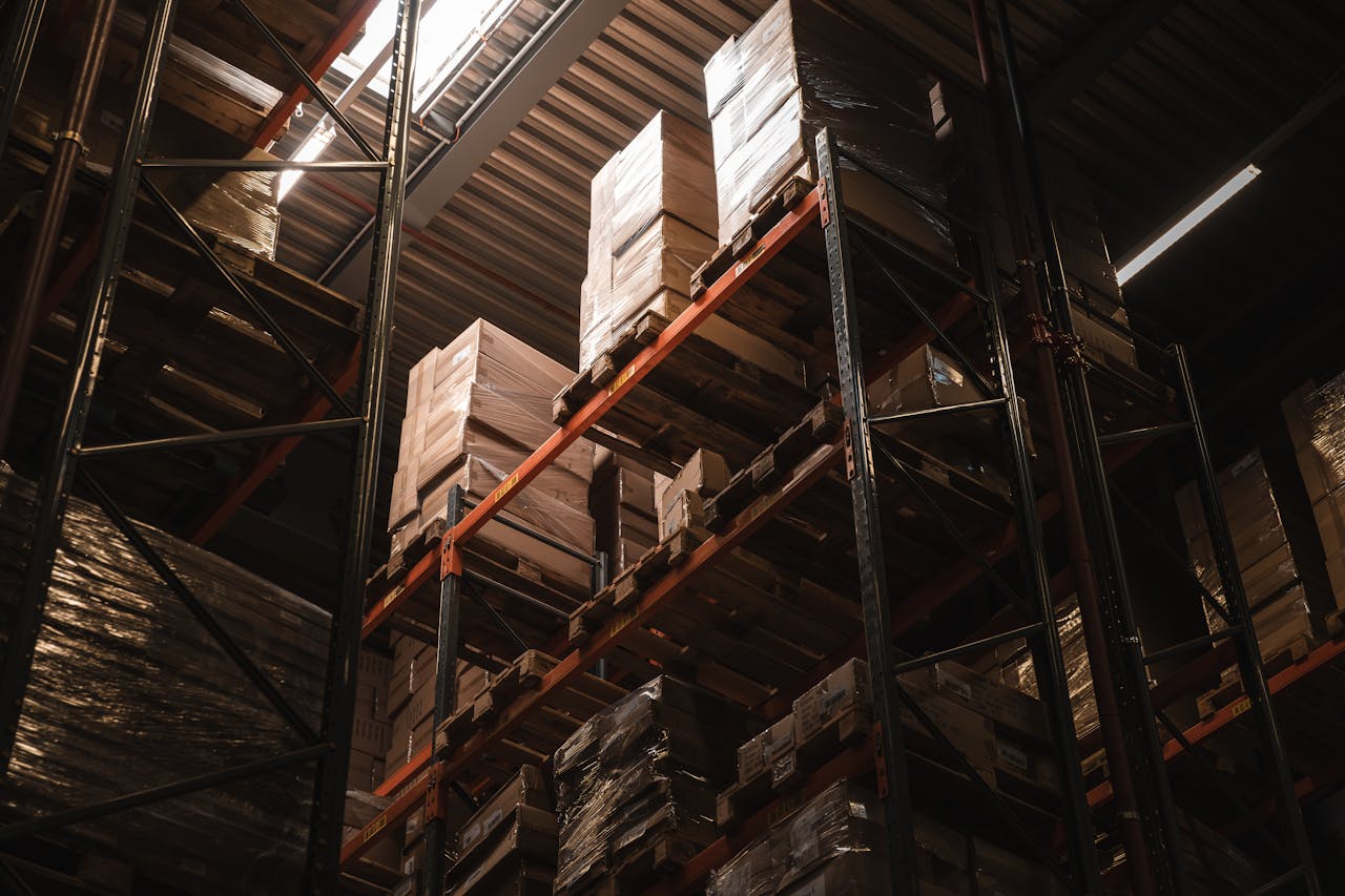 Boxes Standing on the Shelves in a Warehouse