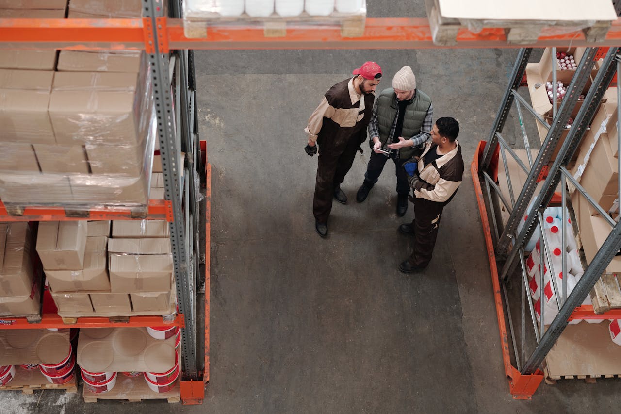 Men Standing in a Warehouse Talking