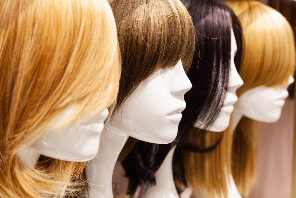 Multi-colored wigs on mannequins