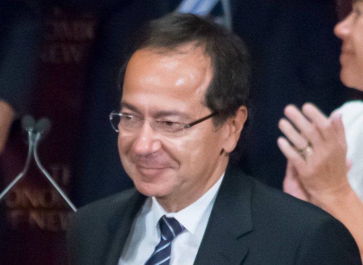 John Paulson stand for applause after Mr. Trump's presentation to the Economic Club