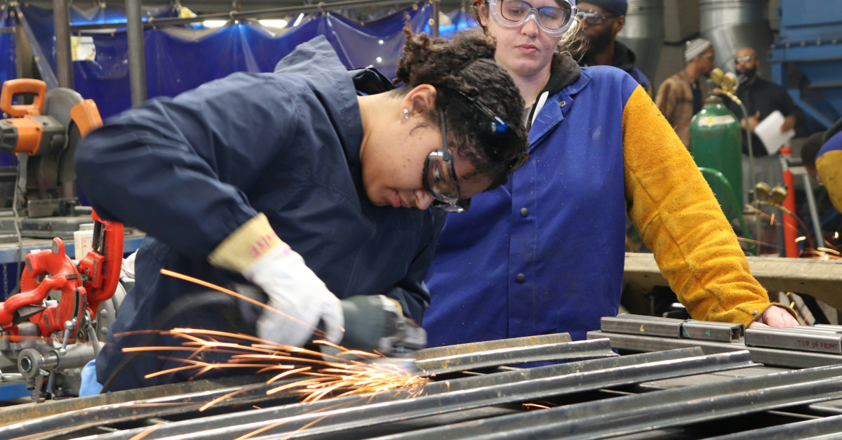 man in blue long sleeve shirt and blue vest