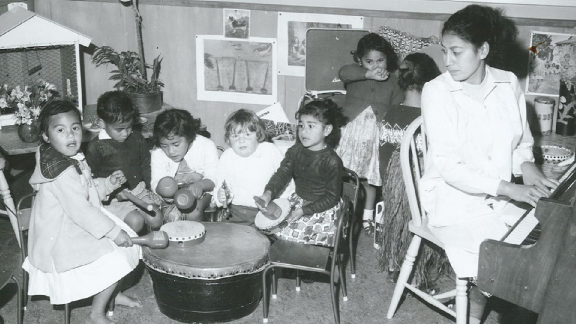 File:At Logan Campbell Kindergarten, the teacher leads a music lesson (1965).jpg