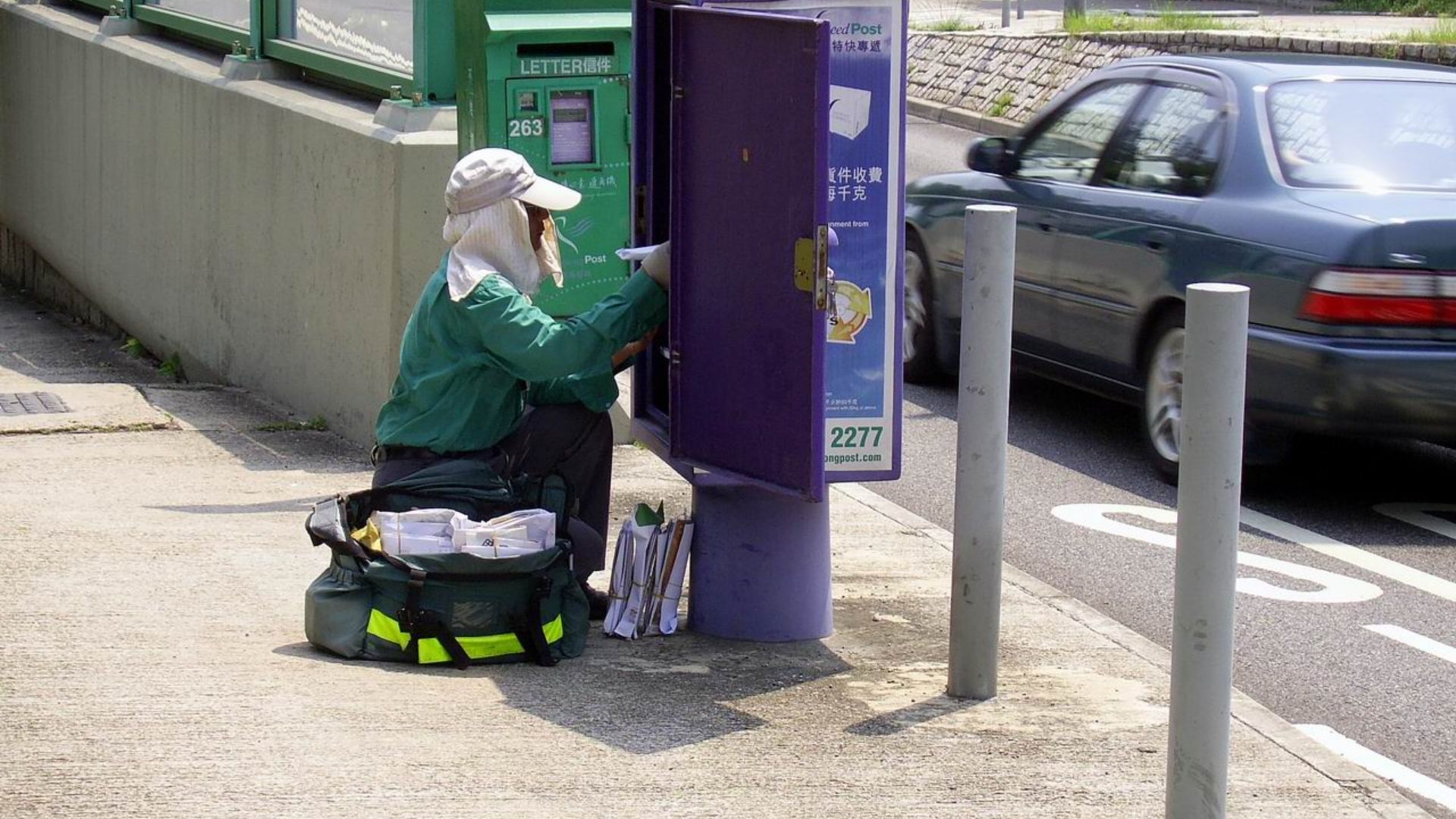 File:HK Postman Collect Letters.JPG