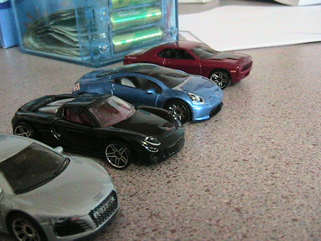 Toy cars on table.