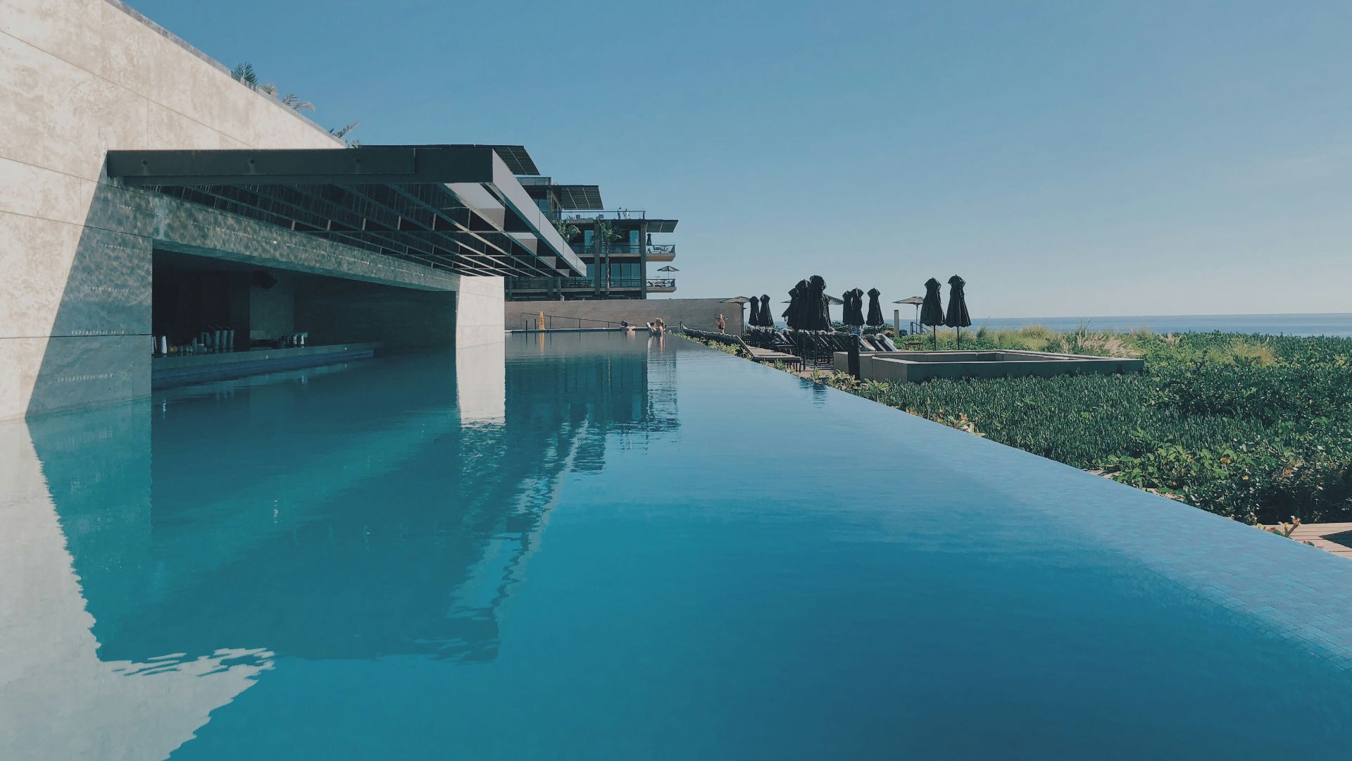 wide angle photo of brown and blue building