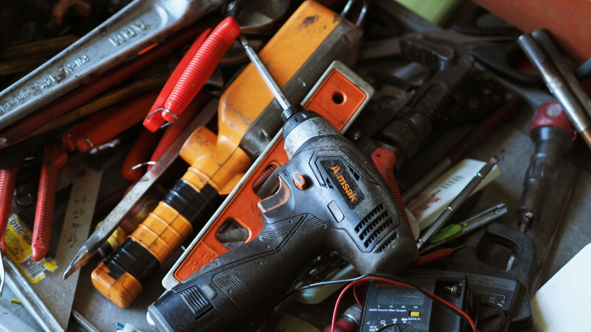 black and orange cordless power drill