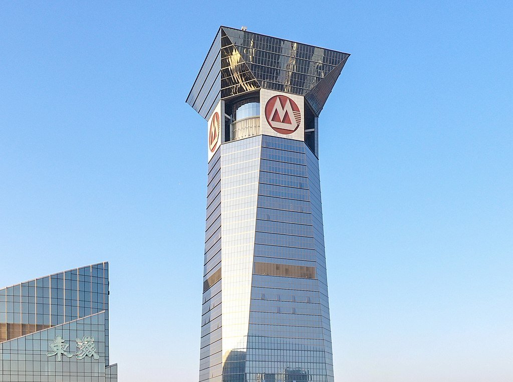 The image shows the corporate headquarters or office building of CMB Company