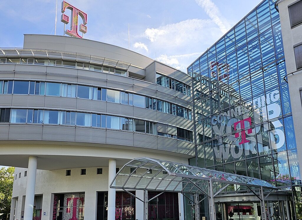The image shows the corporate headquarters or office building of Deutsche Telekom Company