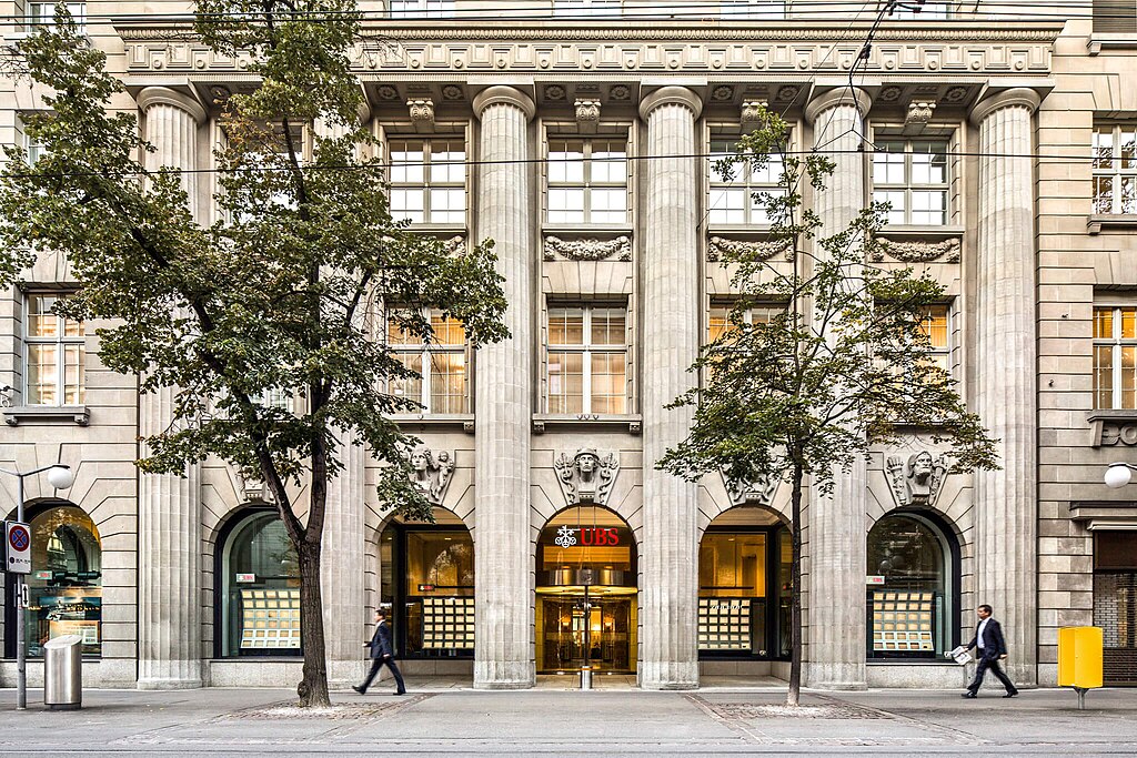 The image shows the corporate headquarters or office building of UBS Group Company