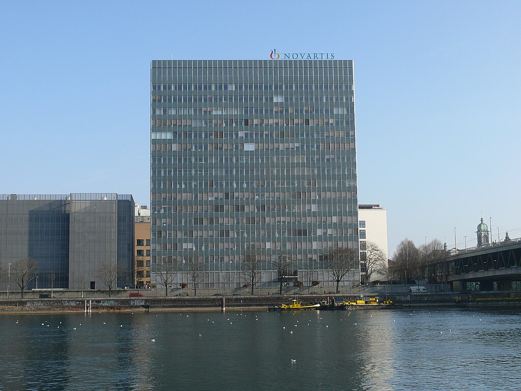 The image shows the corporate headquarters or office building of Novartis Company