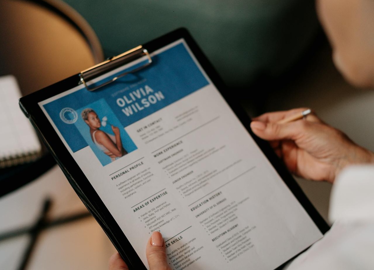 Person Holding CV on Black Case