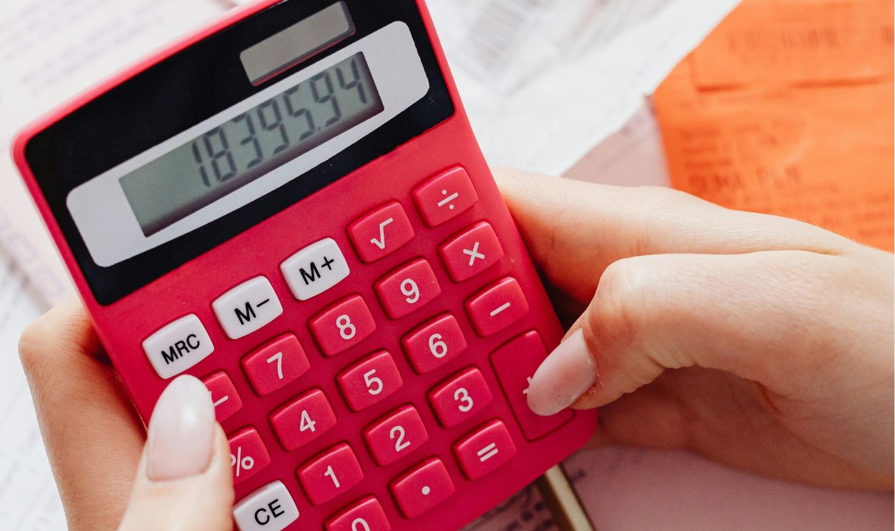 A Close-Up Shot of a Person Using a Calculator